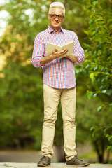 Stylish hipster grandpa concept. Portrait of smiling trendy man