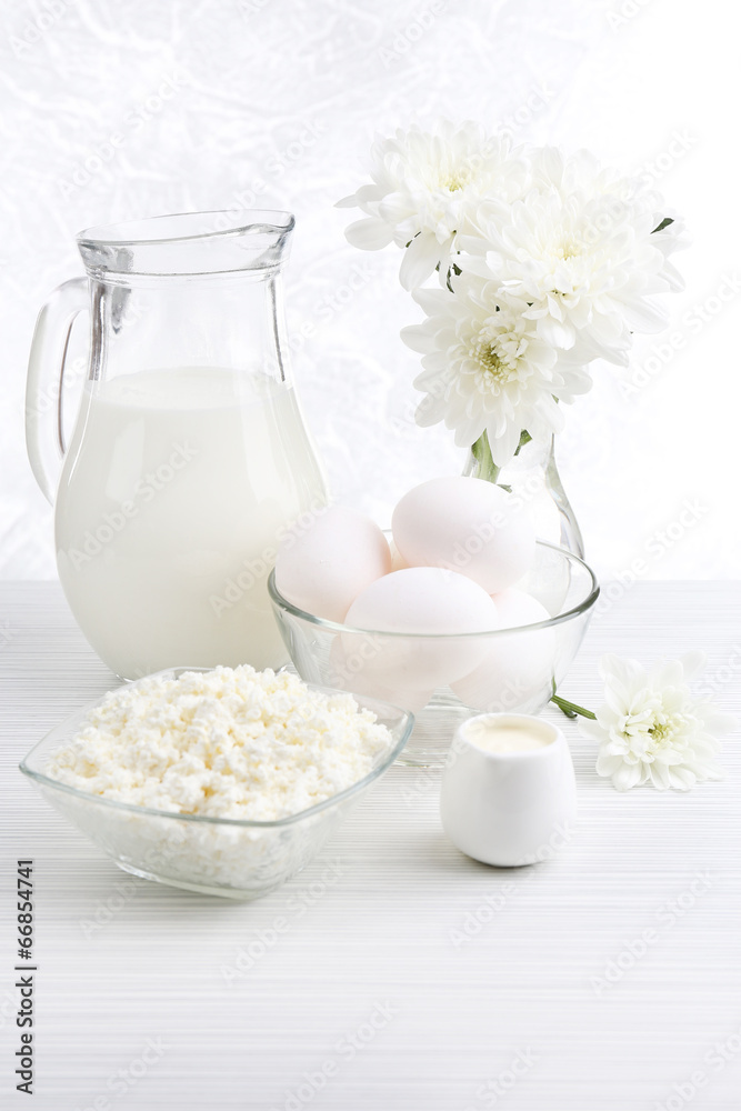 Tasty dairy products on wooden table