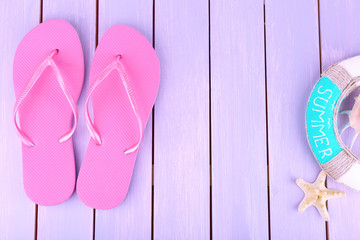 Sticker - Bright flip-flops on color wooden background