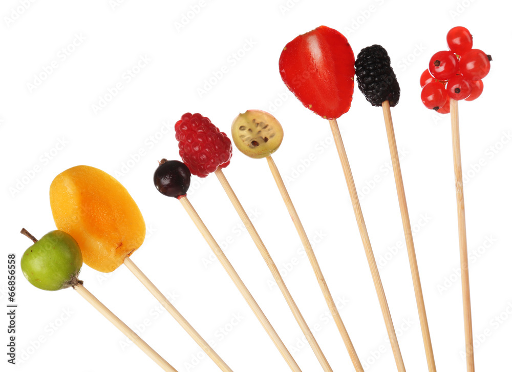 Fresh fruit skewers isolated on white