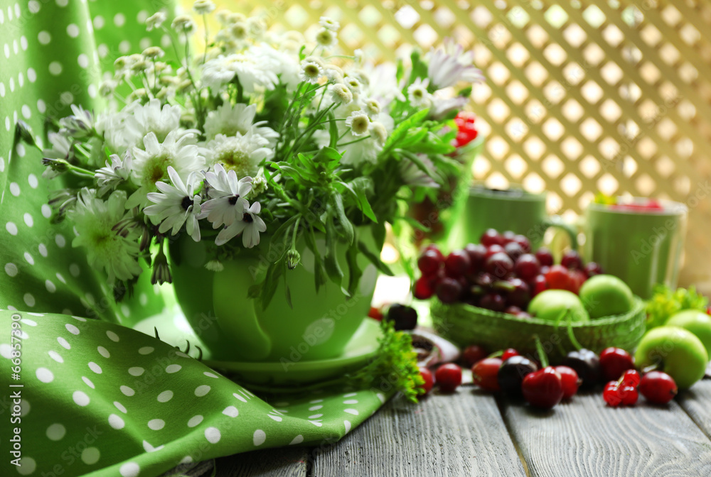 Still life with berries and flowers