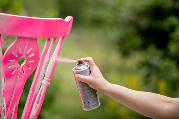 Spray paint an old chair pink