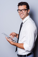 Wall Mural - Examining his brand new digital tablet.