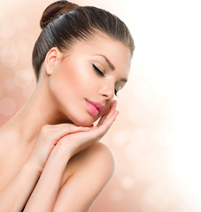 Wall Mural - beauty spa woman portrait. beautiful girl touching her face