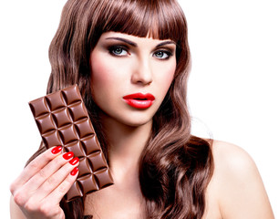 Wall Mural - Beautiful sexy woman with bar of chocolate.