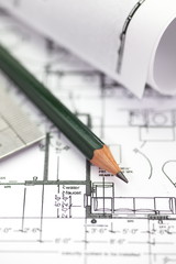 architect rolls and plans construction project drawing