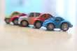 minature colorful cars standing in line showroom sale concept
