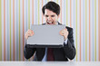 © Helder Almeida - Businessman eating laptop