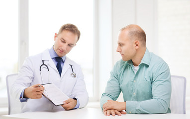 Wall Mural - doctor with clipboard and patient in hospital