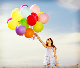 Poster - happy girl with colorful balloons