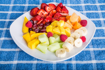 Wall Mural - Cut and Sliced Fruit on a Square White Plate