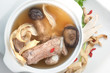 Traditional oriental pork broth with mushrooms