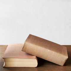 two brown books on the table