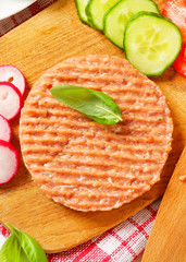 Wall Mural - Raw minced meat patty and vegetables