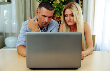 Sticker - Young couple using laptop together