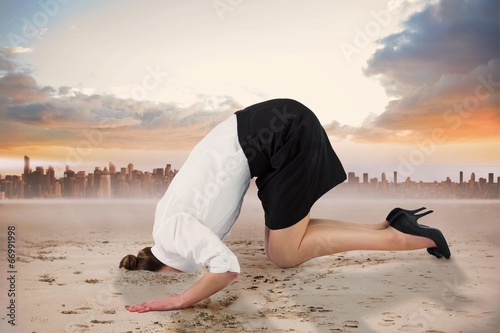 Fotomural Composite image of businesswoman burying her head