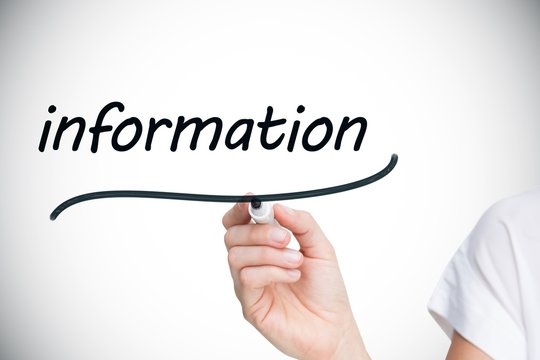 Businesswoman writing the word information