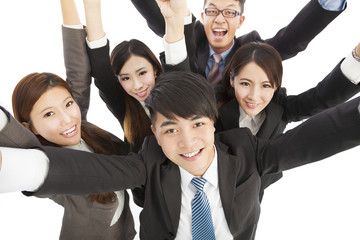 happy young success business team raise hands