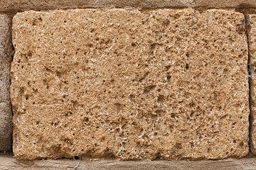 block of tuff on wall of medieval palace