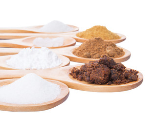 Various type of sugar on wooden spoon over white background