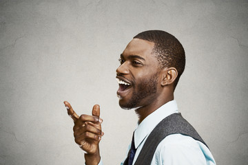 Headshot happy, laughing business man pointing finger at someone