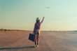 © Alex Photo - Traveler woman waves her hand to airplane