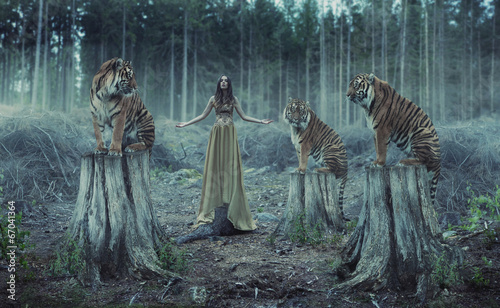 Nowoczesny obraz na płótnie Attractive female trainer with the tigers