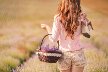 Beautiful girl on the lavender field.