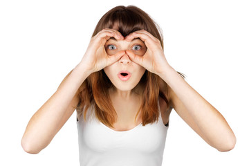 a girl looks at improvised binoculars