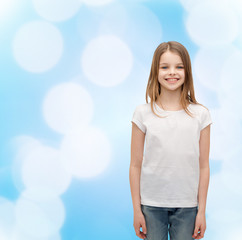 Canvas Print - smiling little girl in white blank t-shirt