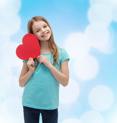 Wall Mural - smiling little girl with red heart