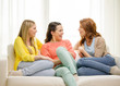 © Syda Productions - three girlfriends having a talk at home
