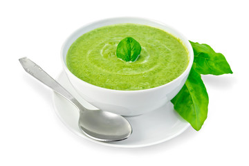 Canvas Print - Soup puree with spinach in a bowl and leaves