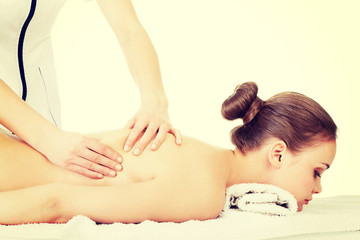 Woman relaxing beeing massaged in spa saloon