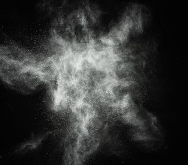 Wall Mural - white powder exploding isolated on black