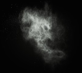 Wall Mural - white powder exploding isolated on black