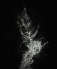 Wall Mural - white powder exploding isolated on black