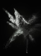 Wall Mural - white powder exploding isolated on black