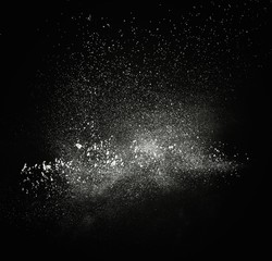 Wall Mural - white powder exploding isolated on black