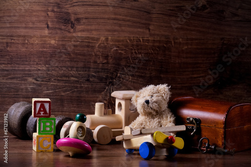 Fotografie, Obraz collection of old wood children toys with teddy bear