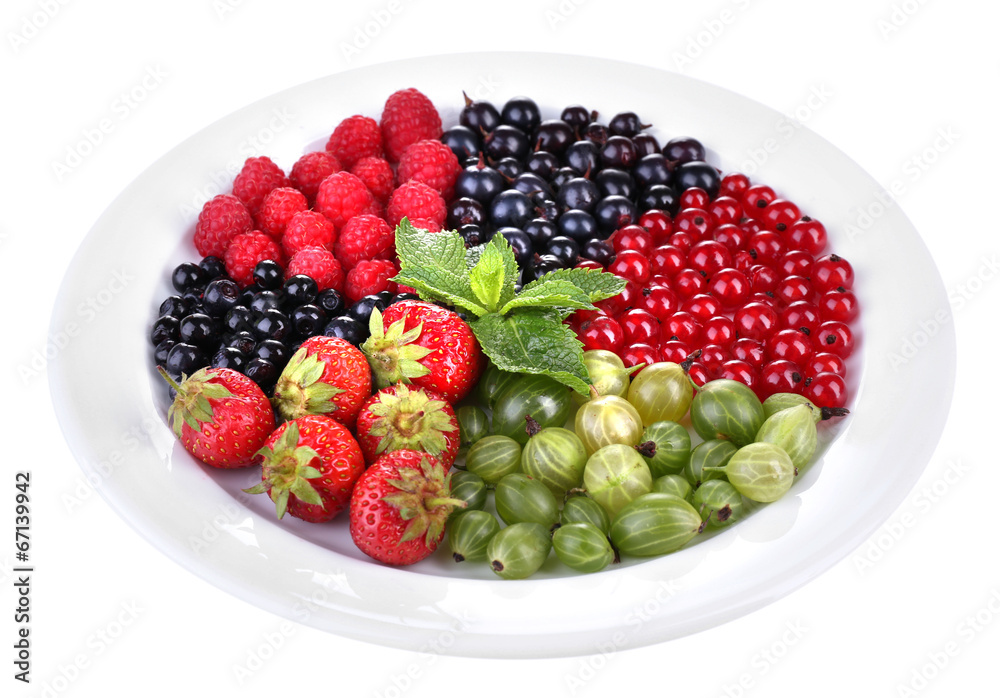 Forest berries on plate, isolated on white