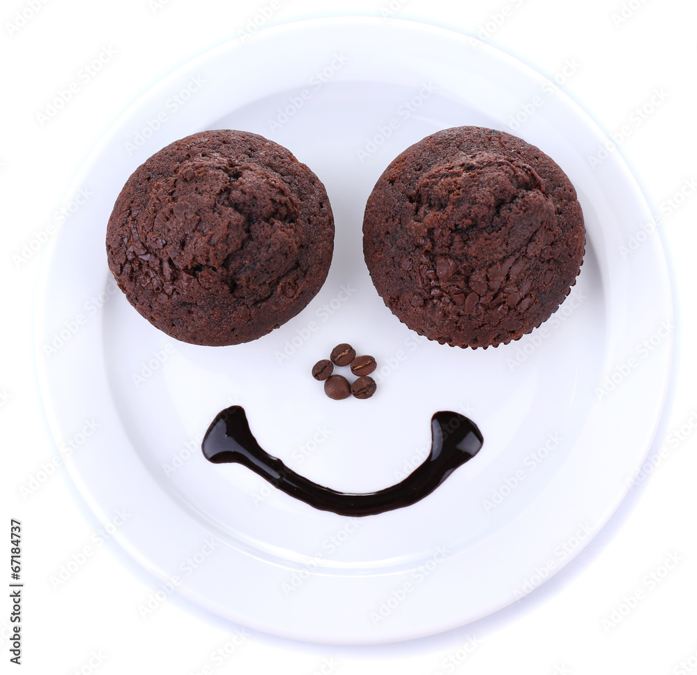 Two tasty muffins on plate isolated on white