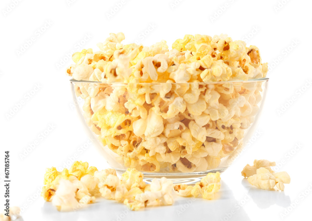 Popcorn in glass bowl isolated on white