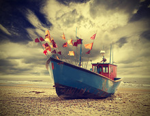 Small Fishing Boat On Shore Of The Baltic Sea, Vintage Toning Applied.