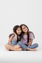 Portrait of little cute Asian girl on isolated background