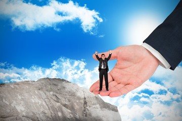 Poster - Composite image of businessman cheering at the camera in large h