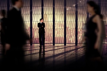 Poster - Composite image of businessman with arms crossed
