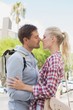 © WavebreakmediaMicro - Young tourist couple about to kiss