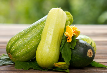 Fresh organic zucchini on the wooden table