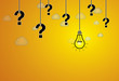 question mark & bright yellow light bulb with idea text hanging